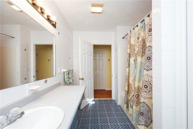 bathroom with vanity and a shower with shower curtain