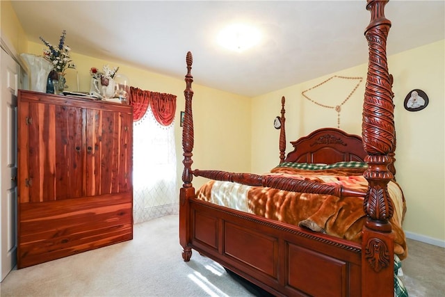 bedroom featuring light colored carpet