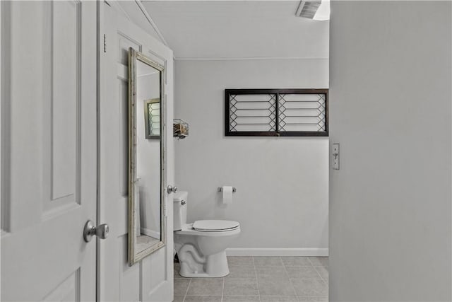 bathroom featuring tile patterned floors and toilet