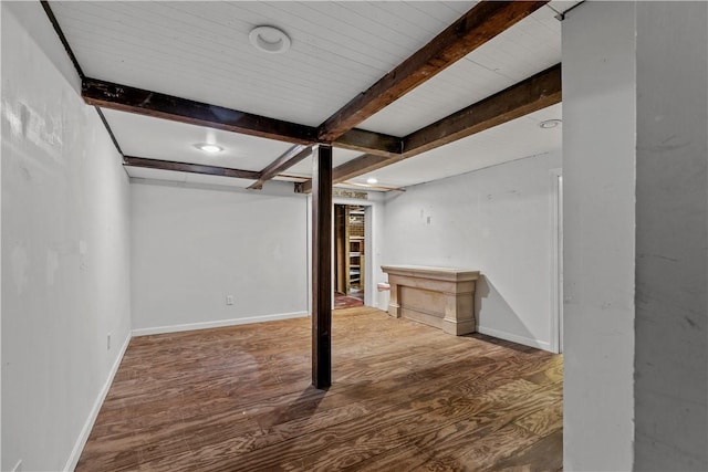 basement with hardwood / wood-style flooring