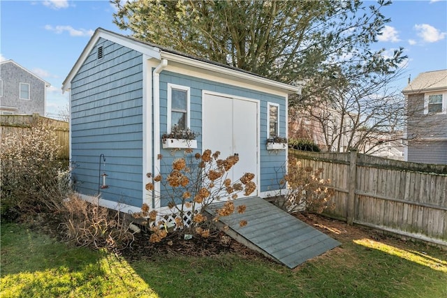 view of outbuilding featuring a yard