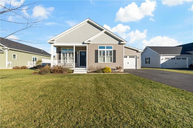 view of front facade with a front lawn, a porch, and a garage