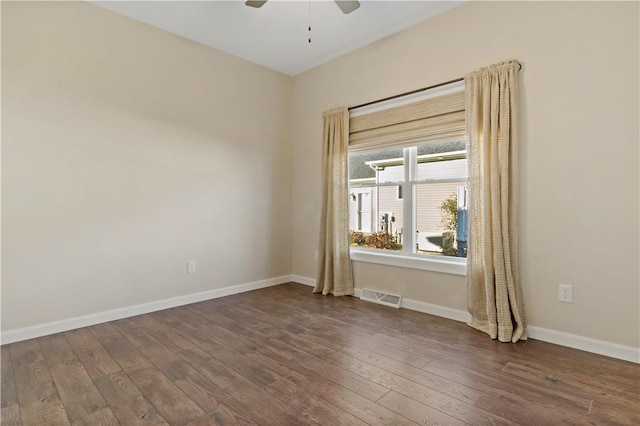 empty room featuring ceiling fan and hardwood / wood-style floors