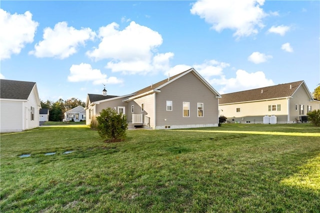 view of side of home with a yard