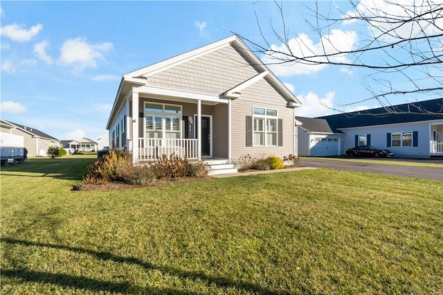 view of front of home featuring a porch and a front lawn