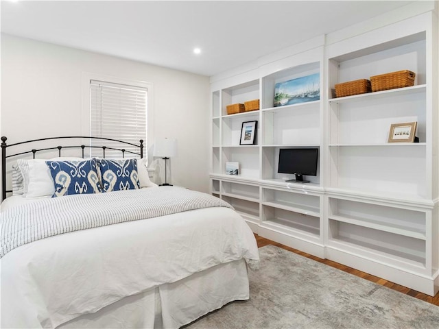 bedroom with hardwood / wood-style floors