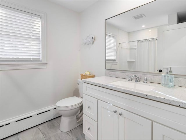 bathroom featuring a shower with shower curtain, vanity, toilet, and a baseboard radiator