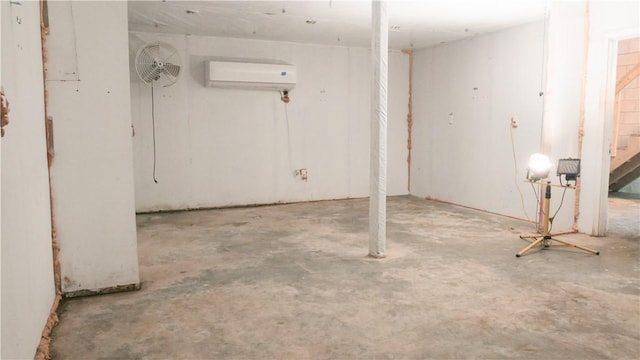 basement with a wall mounted air conditioner