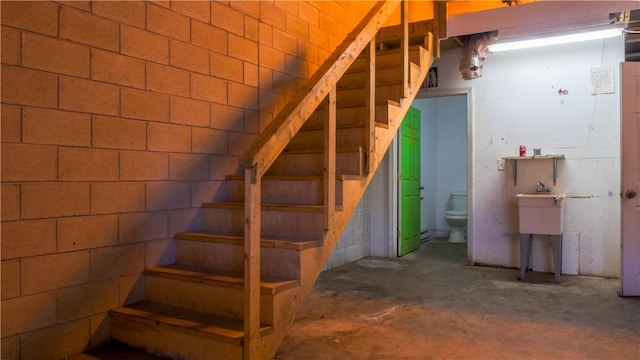 stairway with concrete floors