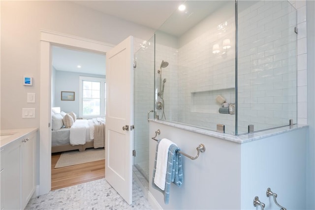 bathroom with vanity and an enclosed shower