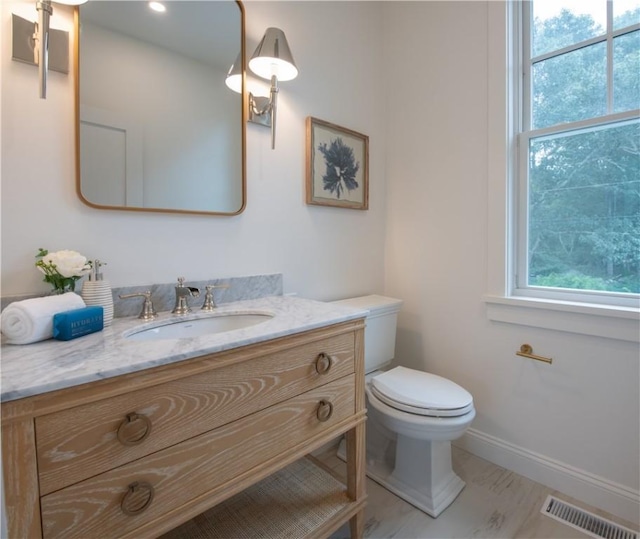 bathroom with vanity and toilet