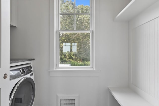 laundry room with washer / dryer and a healthy amount of sunlight