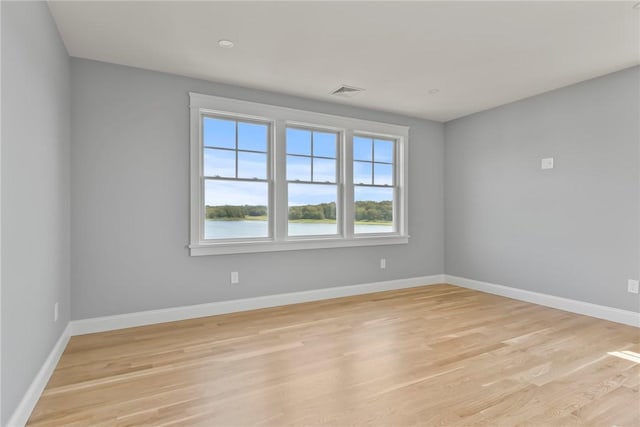 unfurnished room featuring light hardwood / wood-style flooring