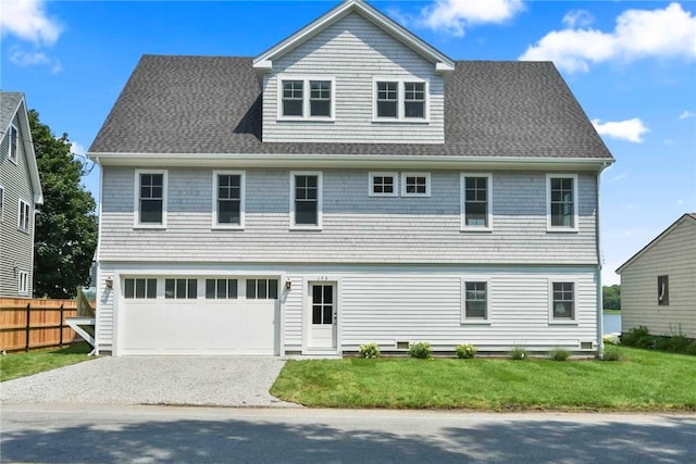 view of front of property with a garage and a front yard