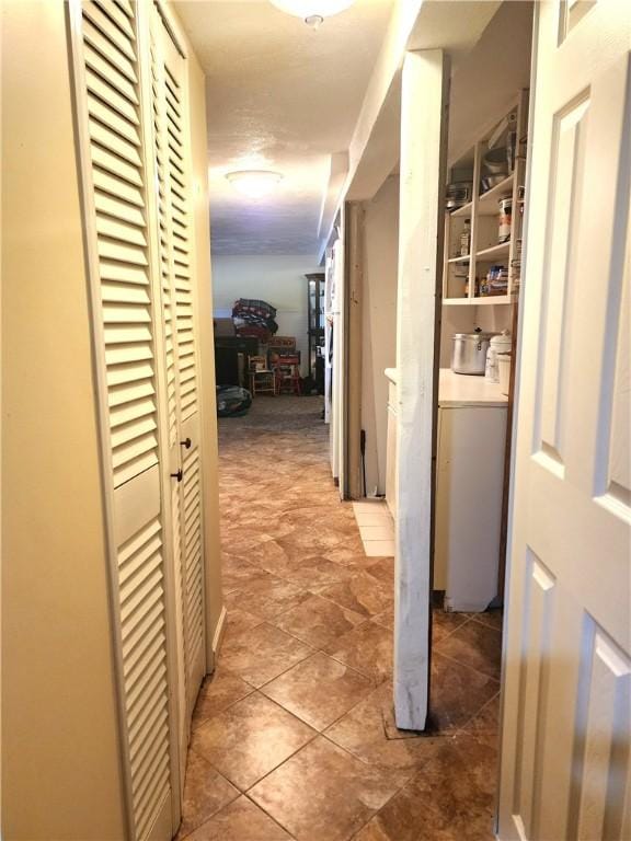 hallway featuring washing machine and clothes dryer