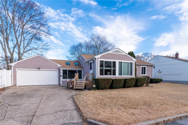 view of front of house with a front lawn and a garage