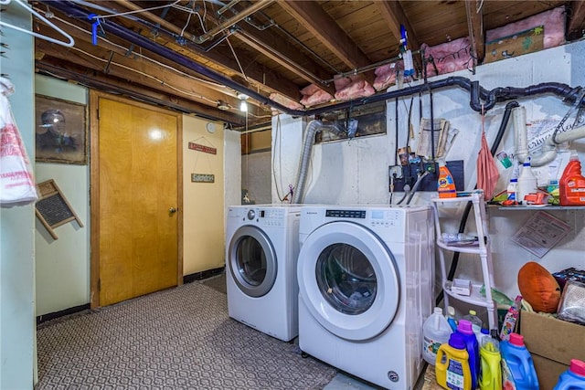 clothes washing area with washer and dryer