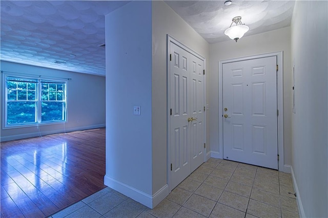 foyer with light tile patterned floors