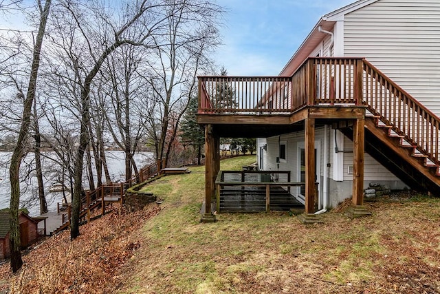 view of side of home featuring a lawn and a wooden deck