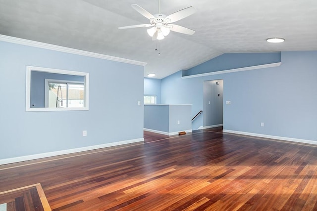 unfurnished room featuring ornamental molding, lofted ceiling, ceiling fan, and dark wood-type flooring