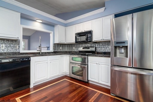 kitchen featuring white cabinetry, sink, black appliances, and lofted ceiling