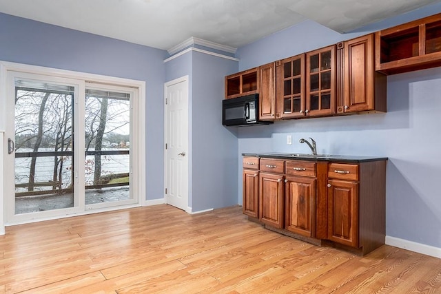 kitchen featuring sink and light wood-type flooring