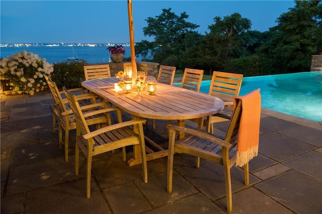 view of patio featuring outdoor dining area and a fire pit