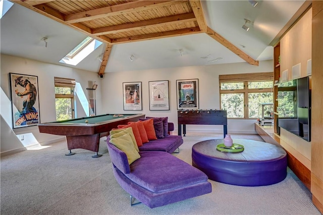 game room featuring vaulted ceiling with skylight, carpet, and baseboards