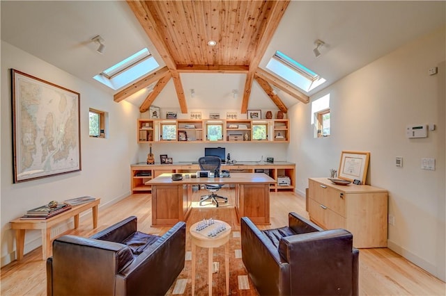 office area featuring vaulted ceiling with beams, light wood finished floors, and baseboards