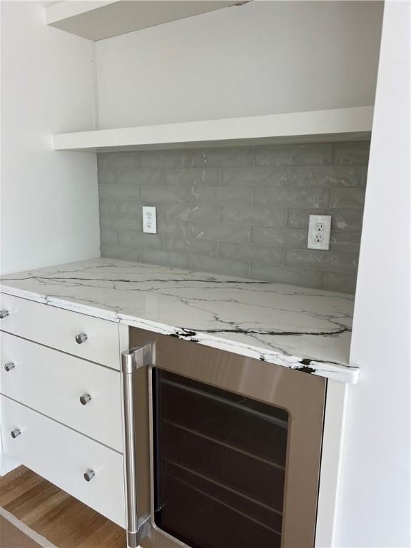 15 Cora St, East Greenwich, RI 02818 - detailed view of wine cooler, tasteful backsplash, and wood finished floors