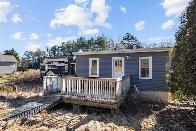 rear view of property with a deck