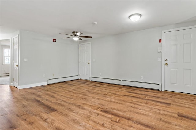 interior space with ceiling fan, light hardwood / wood-style floors, and a baseboard radiator