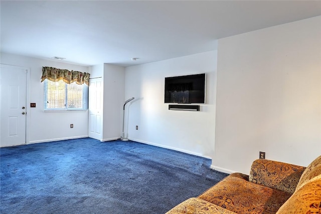 unfurnished living room featuring dark carpet