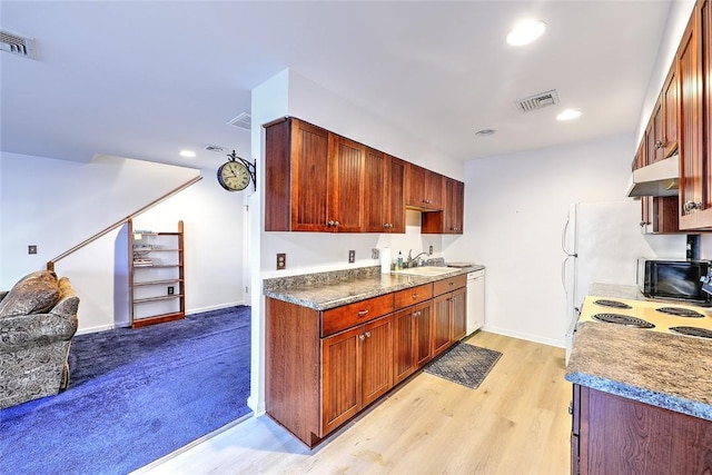 kitchen with white dishwasher, sink, electric stove, and light wood-type flooring