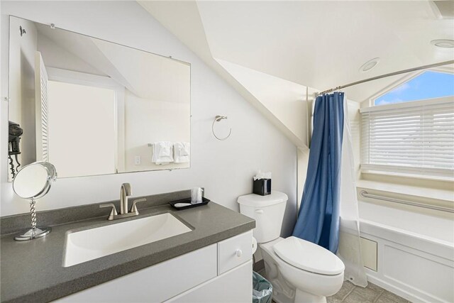 full bathroom featuring shower / bath combination with curtain, toilet, lofted ceiling, and vanity