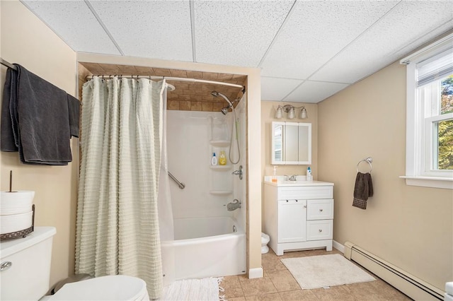 full bathroom featuring a drop ceiling, vanity, toilet, shower / bath combo with shower curtain, and a baseboard radiator