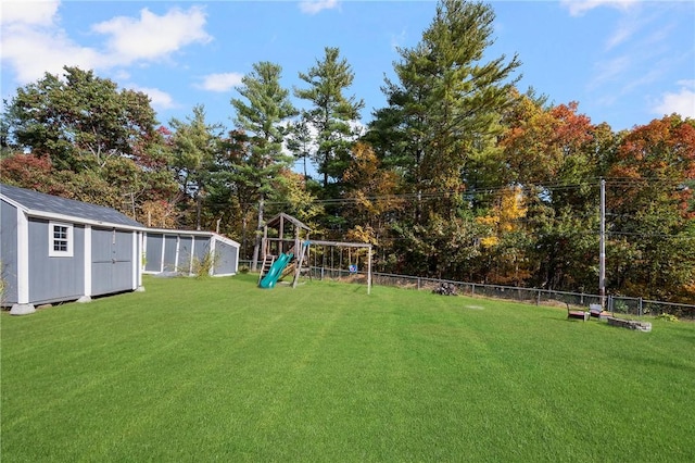 view of yard with a playground and a storage unit