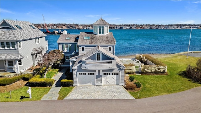 birds eye view of property with a water view