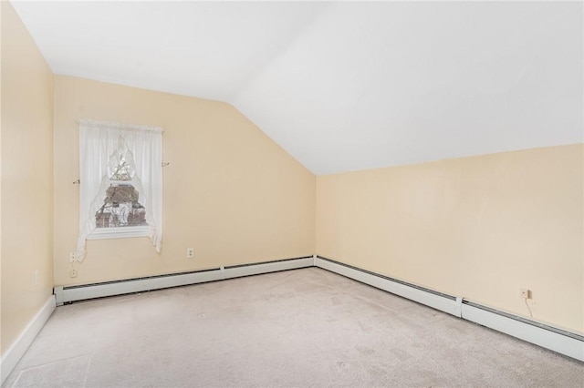 additional living space featuring light colored carpet, a baseboard radiator, and lofted ceiling