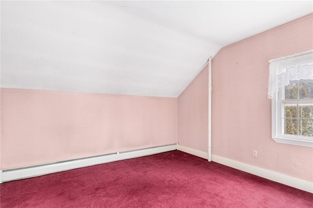 additional living space with carpet, vaulted ceiling, and a baseboard radiator