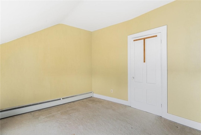 additional living space with light colored carpet, lofted ceiling, and a baseboard radiator