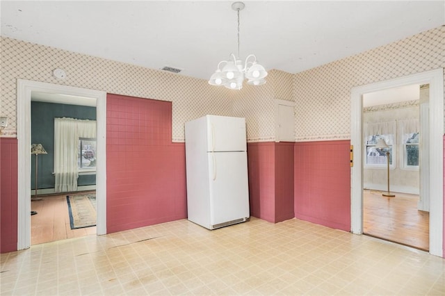 interior space featuring an inviting chandelier