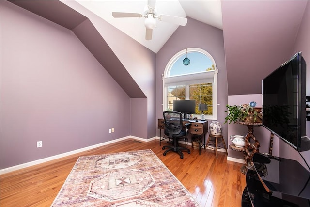 home office featuring hardwood / wood-style floors, ceiling fan, and lofted ceiling