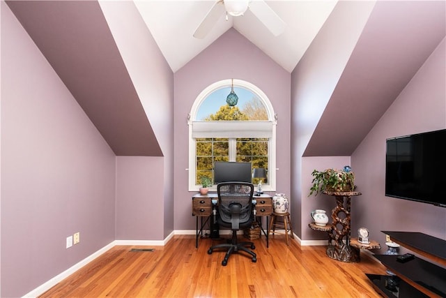 office featuring ceiling fan, light hardwood / wood-style floors, and vaulted ceiling