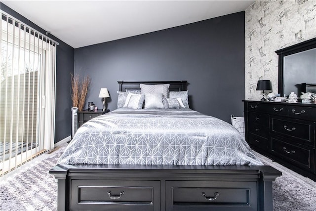 bedroom featuring carpet floors and access to outside