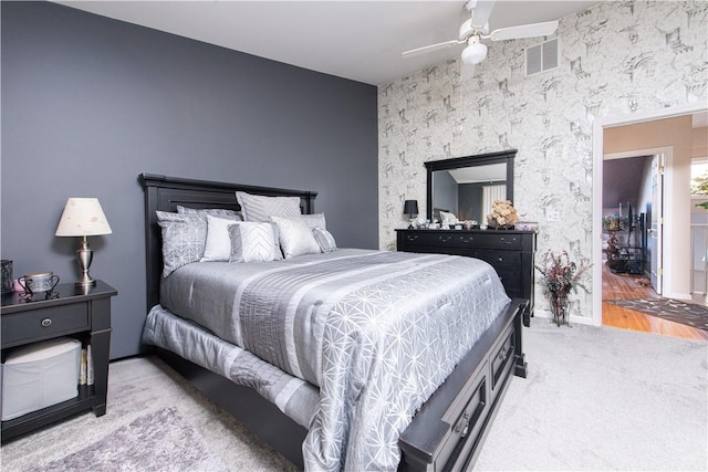 bedroom with light colored carpet and ceiling fan