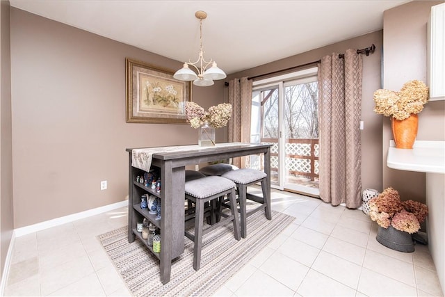 dining area with light tile patterned floors and a notable chandelier