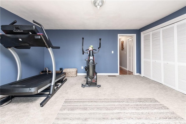 exercise room featuring carpet