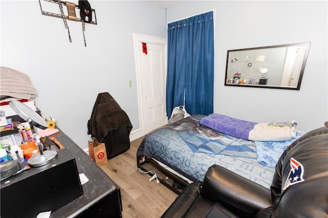 bedroom with wood-type flooring