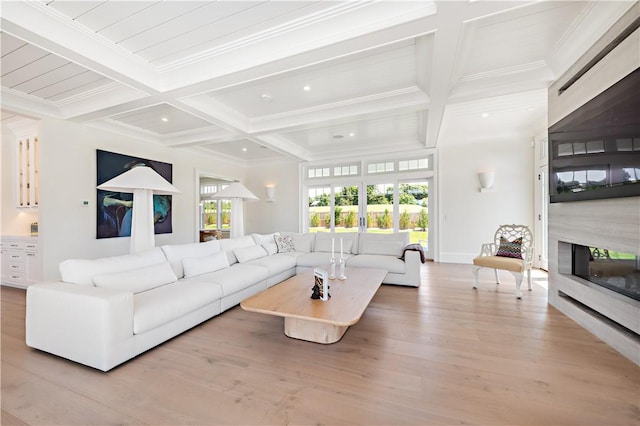 living room with beam ceiling, light wood-type flooring, ornamental molding, and coffered ceiling